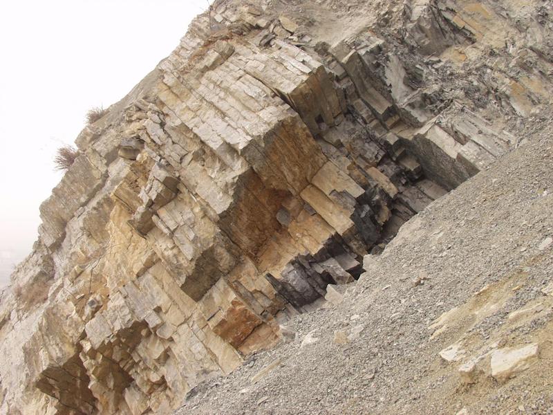 Sedimentary rocks at Meishan, China. These rocks contain signatures of a disturbance in the carbon cycle immediately preceding Earth's greatest mass extinction. Credit: Shuzhong Shen